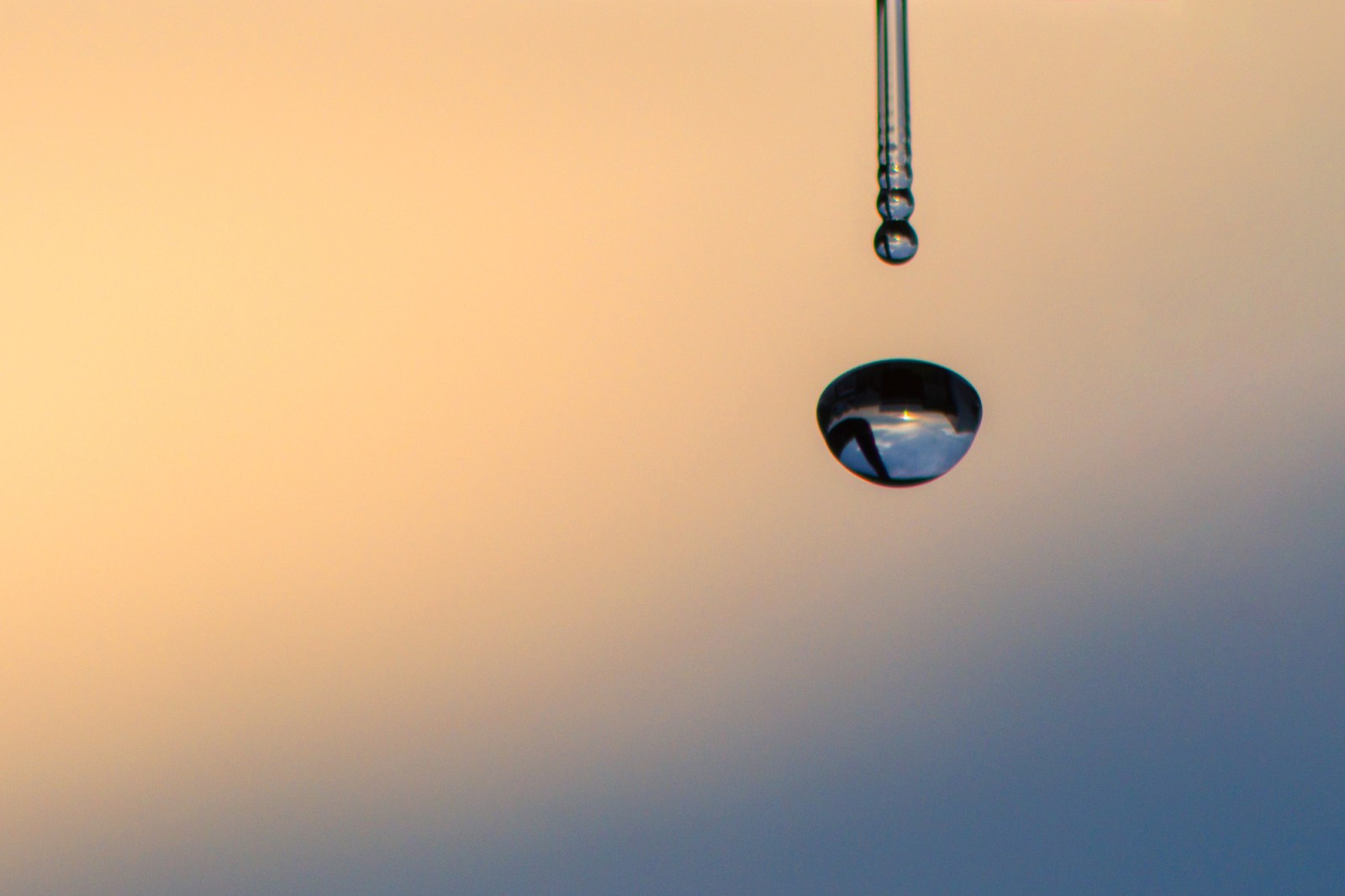 Water droplet on a sunset color background